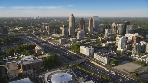 AX39_030.0000011F - Aerial stock photo of I-85 and Midtown Atlanta skyscrapers in Georgia