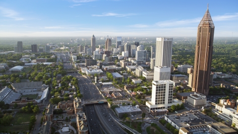 Downtown Connector along city buildings; Midtown Atlanta, Georgia Aerial Stock Photos | AX39_049.0000162F