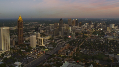 AX40_012.0000000F - Aerial stock photo of Midtown skyscrapers, Downtown skyscrapers in the background, Atlanta, Georgia, twilight