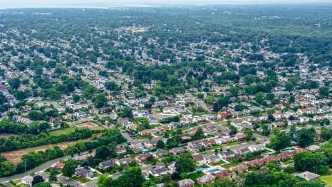 AXP071_000_0002F - Aerial stock photo of Suburban neighborhoods in Massapequa Park, Long Island, New York