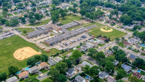 AXP071_000_0007F - Aerial stock photo of The Nassau County Police Academy in Massapequa Park, Long Island, New York