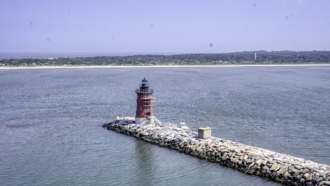 AXP072_000_0003F - Aerial stock photo of A view of the Delaware Breakwater East End Light and the nearby shore