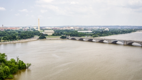 AXP074_000_0011F - Aerial stock photo of The Washington Monument, Lincoln Memorial, and Arlington Memorial Bridge in Washington DC