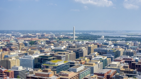 AXP075_000_0012F - Aerial stock photo of The Washington Monument seen from office building rooftops in Washington DC