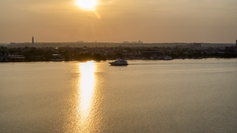 A ferry sailing the Potomac River, Alexandria, Virginia, sunset Aerial Stock Photos | AXP076_000_0002F