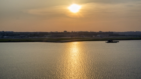 AXP076_000_0005F - Aerial stock photo of Ronald Reagan Washington National Airport, Arlington, Virginia, sunset