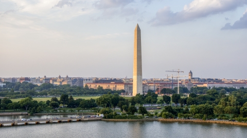 AXP076_000_0009F - Aerial stock photo of The Washington Monument seen from Tidal Basin, Washington D.C., sunset