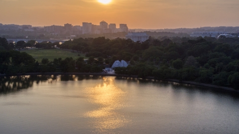 AXP076_000_0011F - Aerial stock photo of Lincoln Memorial and the MLK National Memorial in Washington D.C., sunset