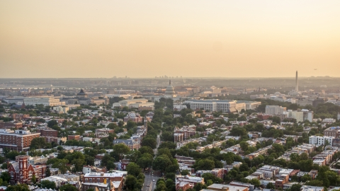 AXP076_000_0016F - Aerial stock photo of Supreme Court and United States Capitol at the end of Maryland Avenue, Washington D.C., sunset