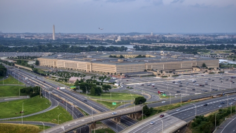 The Pentagon at twilight in Washington, D.C., with the Washington Monument in the distance Aerial Stock Photos | AXP076_000_0024F