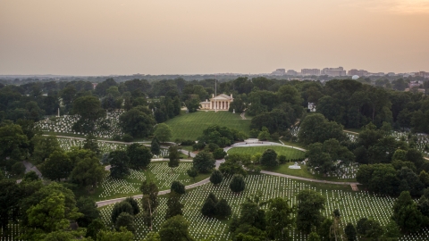 Rows of gravestones near Arlington House at Arlington National Cemetery, Arlington, Virginia, twilight Aerial Stock Photos | AXP076_000_0025F