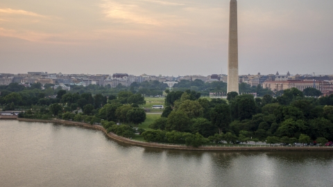 AXP076_000_0026F - Aerial stock photo of The Washington Monument and White House seen from Tidal Basin, Washington D.C., twilight