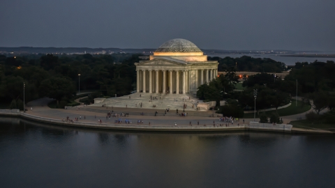 AXP076_000_0036F - Aerial stock photo of The front of the Jefferson Memorial lit up for the night, Washington, D.C., twilight