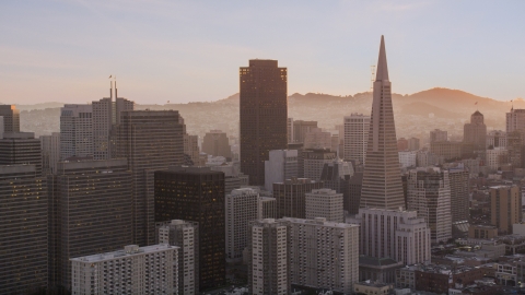 DCSF07_064.0000260 - Aerial stock photo of 555 California Street and Transamerica Pyramid skyscrapers in Downtown San Francisco, California, sunset