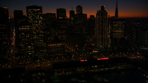 DCSF07_111.0000313 - Aerial stock photo of The downtown skyline and Ferry Building in Downtown San Francisco, California, twilight