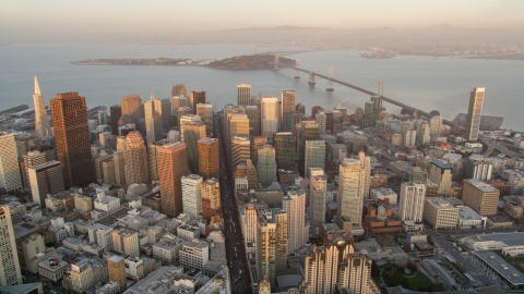 DCSF10_012.0000356 - Aerial stock photo of Downtown San Francisco skyscrapers and views of San Francisco Bay and Bay Bridge, California, sunset