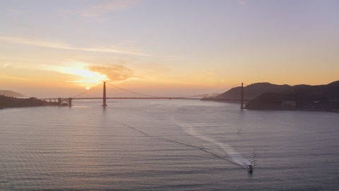 Setting sun behind the Golden Gate Bridge, San Francisco, California, sunset Aerial Stock Photos | DCSF10_025.0000033