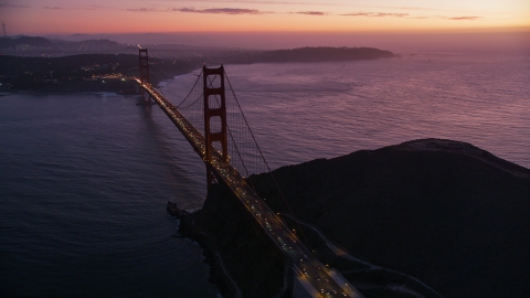 DCSF10_050.0000000 - Aerial stock photo of Heavy traffic crossing the Golden Gate Bridge, San Francisco, California, twilight