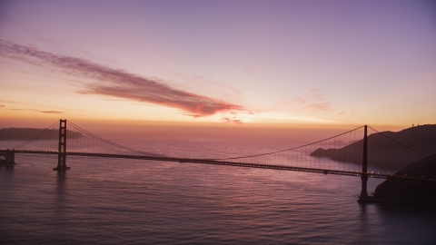 A view of the Golden Gate Bridge with clouds in the distance lit by the twilight, San Francisco, California Aerial Stock Photos | DCSF10_051.0000000