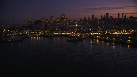 DCSF10_055.0000451 - Aerial stock photo of Fisherman's Wharf, with downtown skyline in the background, San Francisco, California, twilight