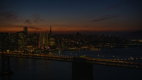 DCSF10_072.0000075 - Aerial stock photo of The Bay Bridge with San Francisco skyline in the background, California, night