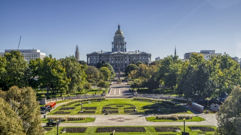 DXP001_000142 - Aerial stock photo of The Colorado State Capitol building seen from low over Civic Center Park in Downtown Denver, Colorado