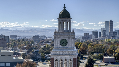 A tall clock tower, part of downtown skyline in background, Denver, Colorado Aerial Stock Photos | DXP001_000162