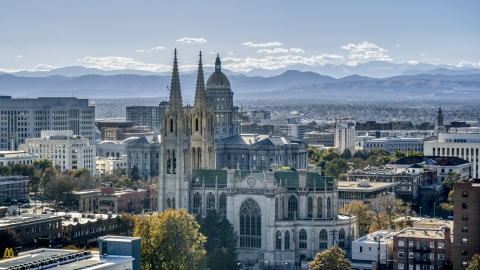 DXP001_000169 - Aerial stock photo of A cathedral with mountains in the distance, Downtown Denver, Colorado