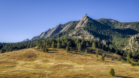 DXP001_000194 - Aerial stock photo of Green Mountain and flatirons behind a tree-topped hill, Rocky Mountains, Colorado