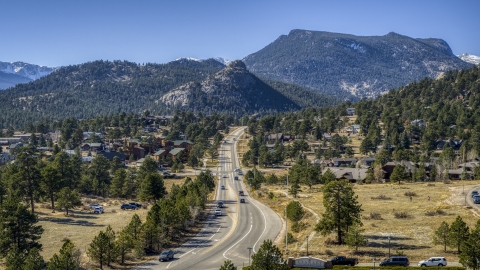 DXP001_000218 - Aerial stock photo of Cars on a road through the mountain town of Estes Park, Colorado