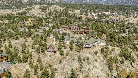 DXP001_000230 - Aerial stock photo of Rural homes on a rugged hillside, Estes Park, Colorado