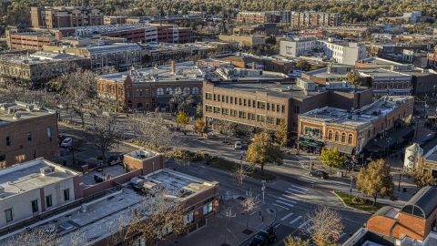 Shops and brick office buildings beside a quiet street in Fort Collins, Colorado Aerial Stock Photos | DXP001_000243