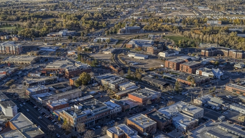 DXP001_000248 - Aerial stock photo of Brick office buildings and small shops near railroad tracks in Fort Collins, Colorado