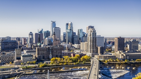 DXP001_000291 - Aerial stock photo of The city skyline seen from a bridge spanning the Mississippi River, Downtown Minneapolis, Minnesota