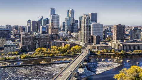 DXP001_000293 - Aerial stock photo of The city skyline on the other side of a bridge spanning the Mississippi River, Downtown Minneapolis, Minnesota