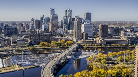 DXP001_000297 - Aerial stock photo of The city's skyline seen from a bridge spanning the Mississippi River, Downtown Minneapolis, Minnesota