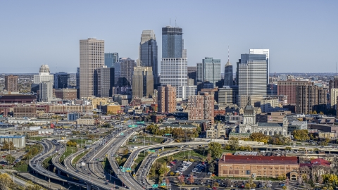 DXP001_000314 - Aerial stock photo of The city's downtown skyline behind the I-394 freeway interchange with light traffic, Downtown Minneapolis, Minnesota