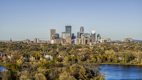 DXP001_000318 - Aerial stock photo of Lakefront neighborhoods and city skyline seen from Lake of the Isles, Downtown Minneapolis, Minnesota