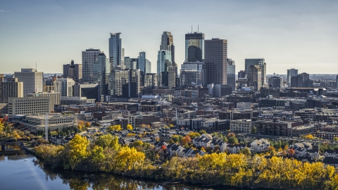 DXP001_000404 - Aerial stock photo of The city's skyline seen from the Mississippi River with autumn trees, Downtown Minneapolis, Minnesota