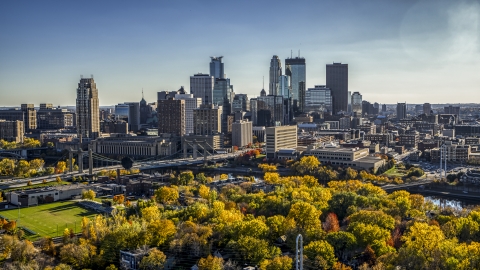 DXP001_000410 - Aerial stock photo of The towering skyline seen from a park by the river, Downtown Minneapolis, Minnesota