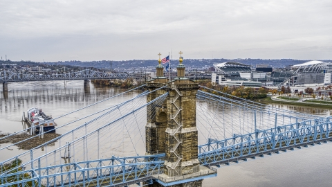 DXP001_000474 - Aerial stock photo of The Roebling Bridge spanning the Ohio River, Downtown Cincinnati, Ohio