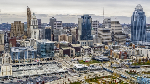 DXP001_000482 - Aerial stock photo of Skyscrapers behind office buildings and Ferris wheel in Downtown Cincinnati, Ohio