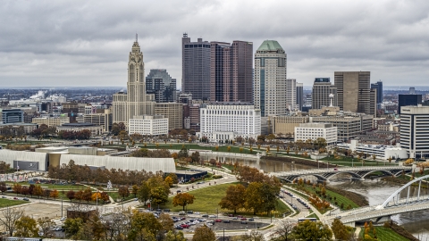 DXP001_000487 - Aerial stock photo of Science museum in the foreground, city's skyline in the background, Downtown Columbus, Ohio