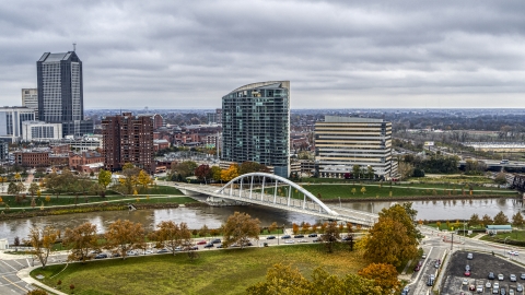 DXP001_000498 - Aerial stock photo of Condo complex and office building by bridge spanning the river in Columbus, Ohio