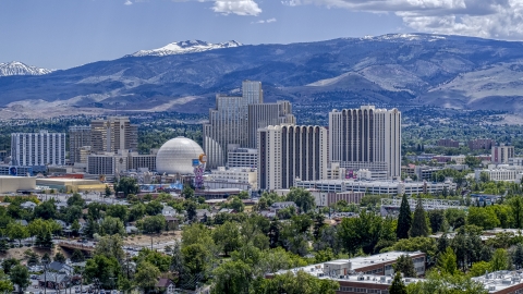 Resort hotels and casinos with mountains in the distance in Reno, Nevada Aerial Stock Photos | DXP001_004_0003