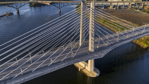 DXP001_010_0015 - Aerial stock photo of The Tilikum Crossing Bridge with no traffic spanning the Willamette River, South Portland, Oregon