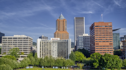 DXP001_011_0008 - Aerial stock photo of Hotel flanked by office buildings, tall skyscrapers in background, Downtown Portland, Oregon