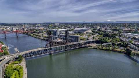 The Steel Bridge spanning the Willamette River near Moda Center arena, Northeast Portland, Oregon Aerial Stock Photos | DXP001_012_0006