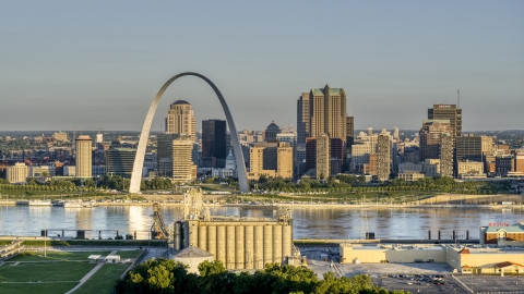 DXP001_021_0003 - Aerial stock photo of A grain elevator and casino against The Arch and skyline at sunrise, Downtown St. Louis, Missouri