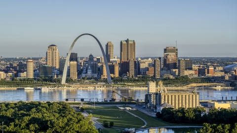 The Arch and skyline seen from a park across the Mississippi River, sunrise, Downtown St. Louis, Missouri Aerial Stock Photos | DXP001_021_0005